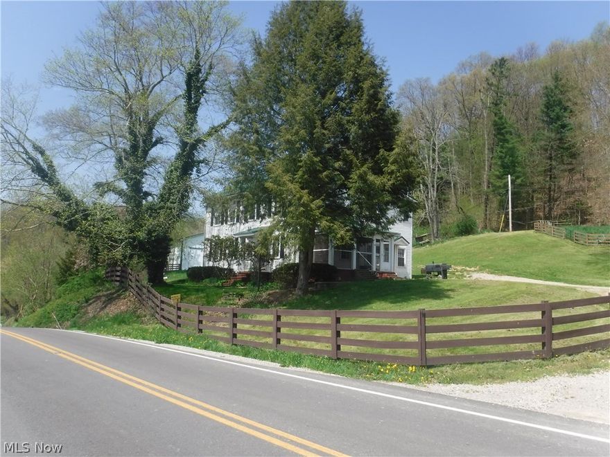 27 acre mini-farm  includes turn of the century, large, 4 bedroom, 2 1/2 bath, 2592 sq. ft. Colonial home plus a 2002, 30X50, 8 stall horse barn that is a dream come true! All pastures and woods are fenced, plus water, the drive-thru barn includes hay loft, tack room, feed storage and very large loafing pens. Updates include new metal roof on home, new septic tank, remodeled bathroom, swabbed water well and new pump, new furnace and ac, rebuilt sand filter & water softner, new water pump and new fencing. This property is truly set up for anyone with horses, ponies, 4-H livestock, whatever you want. Plus it is just 10 minutes from Coshocton. If you want quality country living close to town, this is it!