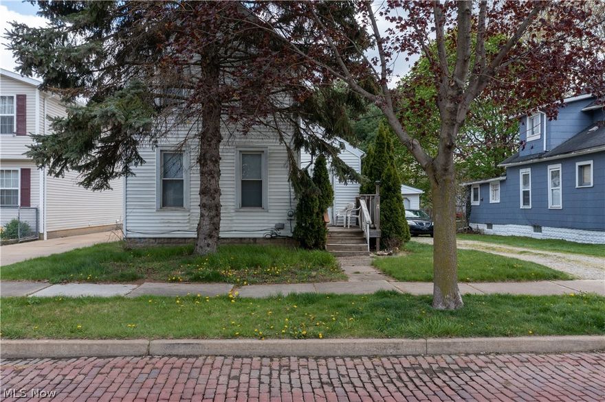 Awesome home with 3 bedrooms of which 2 bedrooms are on the 2nd floor and 1 bedroom is on the 1st floor with many updates! Can be a home for multigenerational living with bedrooms on both floors. Just wait til you see it, pictures were taken prior to a new roof that was just installed! Home has beautiful colors and flooring throughout. Large kitchen, Living room, Dining room, Full updated bathroom with shower, and sunroom rear entry round out the 1st floor. Newer water tank, updated durable flooring as well as carpet in bedrooms throughout, vinyl siding for ease of maintenance, designer colors and fresh! Home includes central air conditioning, updated exterior doors and mostly vinyl windows for efficiency. Oversized detached garage that is one car AND large enough to add a work bench as well as a large yard with fire ring to entertain and relax! Don't miss out on this affordable home, call listing agent or your favorite real estate professional for your personal tour of the property to