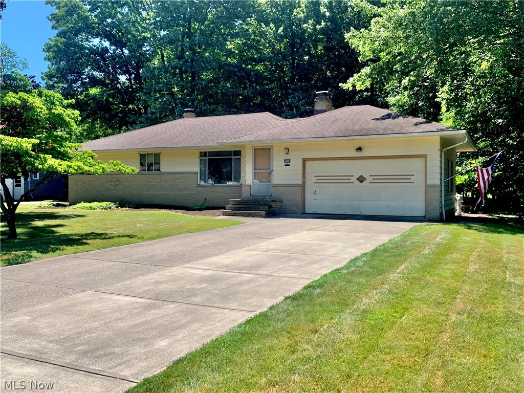 Well maintained ranch with private wooded backyard and hardwood floors available in Broadview Heights! The living room greets you with a beautiful fireplace with stone surround, oversized front windows for natural light, dovetail ceilings and hardwood floors that flow throughout the first floor. The dining room is open to the living room and has a slider to the back patio for easy grilling, relaxing or entertaining on the sizable, flat, usable backyard — so nice! There are 3 bedrooms off the main hallway each with hardwood floors and ample closest space. The bedrooms share a full bath with ceramic basketweave tile floors, tub/shower combo & linen closet. The kitchen has newer cooktop, refrigerator and microwave (wall oven and dishwasher also available) and access to the 1/2 bath, lower level and 2 car garage w water, drain, keypad & remotes. There is so much space in the basement! The rec room is large and can be your man cave, kids hangout or family room -- you choose! There is a bonu