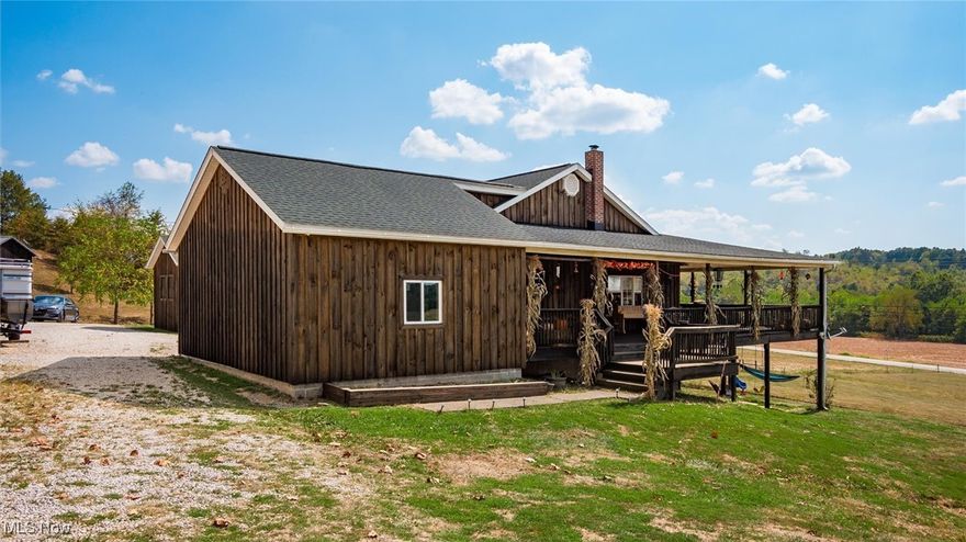 Enjoy country living on this 10-acre farm featuring fenced pastures and a well-kept hen house—ideal for livestock, horses, or hobby farming. This 5-bedroom, 2-bath home offers an open kitchen with oak cabinets, hardwood floors, and a large island. The primary suite includes a walk-in closet, a jet tub, and a walk-in shower. Most of the windows throughout the home have been replaced, adding comfort and efficiency. Recent updates also include new wood siding and new roofs on both the home and the barn. Outdoor living is enhanced by a wide covered deck and a brick patio with beautiful views. The property also offers a barn, a 3-bay open garage, and a basement plumbed for additional living space. Siding and window trim will be completed before transfer.