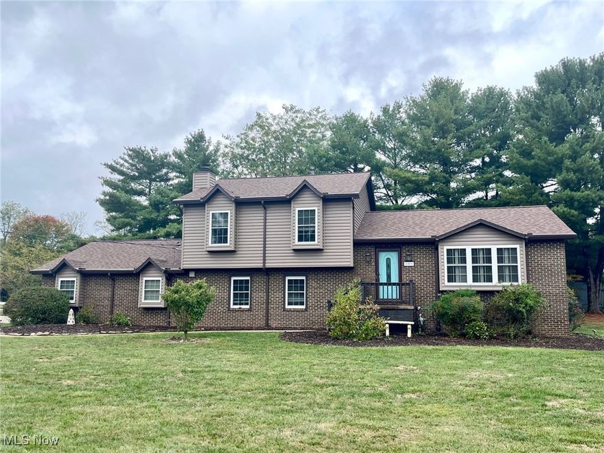 TAKE A LOOK AT THIS!  This awesome home has brand new upgraded, premium siding after being wrapped and all the wood trim boards removed.  It is no longer a tudor style home and exudes contemporary style and freshness!  This wonderful 3-4 bedroom, 2-1/2 bath home in a lovely subdivision has been updated inside and out from top top to bottom in the past few years.  The remodeled kitchen features beautiful hickory cabinets custom built by Gillard Construction, Corian countertops and an attractive tile backsplash.  With a double wall oven in additional to the free standing range the gourmet cook/baker will be able to entertain lots of guests.  The home features beautiful new low-maintenance LVT flooring in the foyer, living room, dining room and kitchen as well as the 3 upper bedrooms.  The spacious living room features a bay window area with custom built shutters.  The living room is open to the dining area which offers access to the covered rear deck and backyard.  The upper level features a spacious master bedroom with a new shower in the master bath.  There are 2 additional bedrooms and a large full bath on this floor.  The first floor features a massive family room with a stone front, woodburning fireplace and an office/den area in addition to the laundry room with ceramic tile floor and the convenient 1/2 bath.  The lower level offers a bedroom/bonus room and plenty of storage in the unfinished area.  The backyard is a gardener's dream with a large fish pond and lush landscaping getting ready to bloom.  Relax on the covered deck while listening to the birds sing and enjoying time with friends and family.  The long list of improvements over the years include a new driveway, new 30 year roof, all new windows, new exterior doors, new HVAC, new flooring, new interior doors, new crown molding throughout, new shower, Nest thermostat, doorbell camera and locks, new gutters and gutter guards and more.   Don't miss this golden opportunity to live in a great neighborhood!