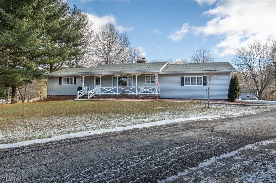 Want an impeccably kept ranch with a brand new kitchen and tons of updates? Do you like to hunt deer, rabbit or squirrel on your own property? This home has it all! This beautifully updated ranch on just about 15 acres is a move in ready! Not one detail has been overlooked. Enjoy sipping coffee on your large front porch. Your living room boasts a 2 sided wood burning fireplace that also provides warmth and charm in your brand new kitchen complete with GE stainless steel appliances and Amish built Hickory soft touch close cabinetry. Brand new laminate flooring throughout the kitchen, hallways, and bathrooms. Enjoy the sunsets in the sunroom made out of warm Pine and large windows or step outside onto your large deck overlooking the apple and pear orchards, blueberries and grape vines. The 3 car garage is heated and has ample workspace. A large 20 x 31 barn with 2 stables and electricity is just steps from the house. The home is equipped with a security system, a new heat pump and wood b