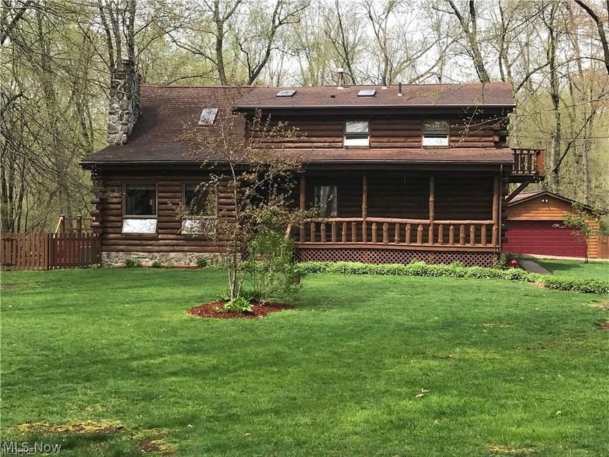 This custom built log home is a must see! Quality in construction with attention to detail in the finishes Featuring a story and a half of windows and skylights highlighted by the wood beamed vaulted ceilings. The open floor plan make it perfect for family gatherings and entertaining. Kitchen offers the amenities any chef would need: new built in oven, cook top range, granite counters, tile back splash, and ceramic tile flooring. The dining area is nicely sized, surrounded by a wall of windows overlooking the wooded lot, and a glass slider leading out onto a 3 level wrap around deck. Great room boasts soaring wood beam ceilings and a stone fireplace with hearth. The comfortable light filled family room offers vaulted ceilings with skylights. There are two additional bedrooms with one half bath and a luxury full bathroom on the first floor. The full bath features a walk in tile shower with glass surround, a claw foot soaking tub and ceramic tile flooring. The master bedroom and luxury b