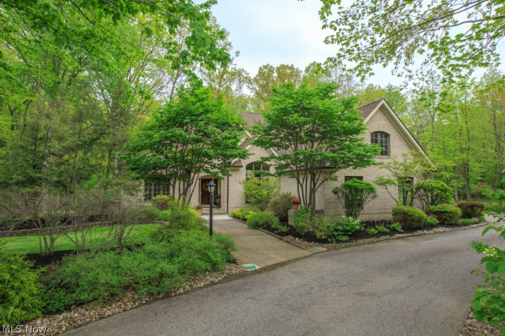 Welcome to this magnificent Colonial set back from the street and nestled amid mature trees. The first floor offers a Master Bedroom Retreat complete with Balcony and Glamour Bath. The huge Kitchen is ideal for any chef and includes stainless steel appliances. The first floor is an open concept floor plan complete with Den, Dining Room with vaulted ceilings, Sunroom, and Laundry Room. The Great Room has a wall of windows allowing ample natural lighting and a Fireplace. Three additional Bedrooms are on the second level. The Backyard is your own private retreat offering a Multi-level deck and stone walkway. Don’t miss the opportunity to live in this stunning community!
