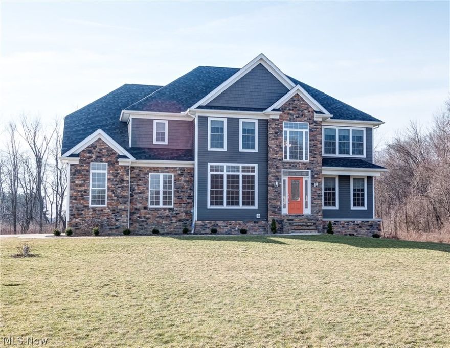 Amazing opportunity to own a new home without the build time & stress! Artistic Design Contemporary Colonial located in Auburn Township on 3 acres of beautiful land. No details spared in the construction! 4 bedrooms all equipped w/ full bathrooms that ultimately make life so much easier to function. Enter into the front door to hardwood floors & an open floor plan. Formal dining room features transom windows & plenty of space for holiday company. Private office space is perfect for the work from home buyer or even a family computer room. Great room features gas fireplace with above entertainment space & 18 ft. ceilings with amazing windows. Kitchen features granite counters, buffet, island with pull out storage, induction cook top, eat in breakfast area & the sought after fridge/freezer side by side combo (all appliances included!) All 4 bedrooms upstairs including the laundry room (washer & dryer stay!). Master features his/hers vanities, private commode, soaking tub (over looking pri