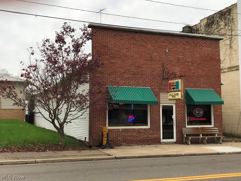 Excellent opportunity for a turn key investment! Located in Utica, OH near the high traffic intersection of StRt 13 & 62. Sale includes a working bar “The Village Inn” and the building itself. Property consists of a 1,564sqft business space on main floor and 989sqft apartment above, offering 3 bedrooms and washer/dryer hookups. Live upstairs while running the business or rent it out to cover part of your monthly expenses! Seller has recently updated/upgraded many things including a granite counter, security cameras and point of sale system. Large/long bar with ample seating, dance floor and walk-in cooler add to the appeal. All fixtures and chattels owned by the sellers will convey including seating, DJ station, glassware, taps, kitchen oven and accessories, signage and much more! D-1, D-2, D-3 & D-3A liquor licenses can also transfer. The space itself is as unique as it is welcoming with original built in cabinetry, exposed brick and high ceiling; small town living with recent commerc