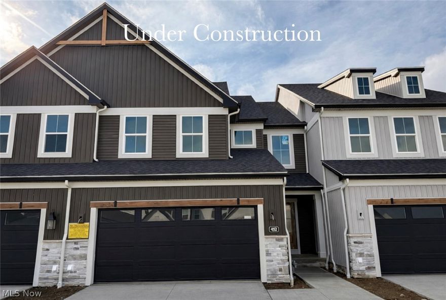 Beautiful 2-story townhome under construction for late Spring move-in! This brand new plan welcomes you with a dedicated 2-story foyer, luxury vinyl plank flooring throughout the first floor, and 9' ceilings throughout. The kitchen features a 7.5' quartz island, walk-in pantry, upgraded appliances with range hood, and ceiling-height soft-close full-overlay cabinetry with hardware. The dining area opens onto an expanded 10 x 17' patio, making indoor-outdoor entertaining a breeze. Open to the great room, owners will enjoy the view of the cozy fireplace. A spacious powder room with vanity cabinet and laundry room, complete with utility sink, wrap up the first floor. Wrought iron spindle railing leads to the 2nd floor, where you'll find the oversized primary suite with spacious sitting area, tray ceiling, and ensuite bath that boasts an 11.5' walk-in closet, tile shower, separate linen closet, dual quartz vanities, and private water closet. Two additional bedrooms, each with walk-in closets, and a full bath, complete the 2nd story. The full basement with 9' ceilings and rough-in plumbing is perfect for storage or future finishing, and the 2-car attached garage provides for easy coming and going. Low-maintenance living means snow removal and lawn care are done for you, adding valuable time back to busy schedules. Protected conservation area, sidewalks and street lamps, and a community pond with fountain add to the appeal of this thoughtfully designed neighborhood. Ideally situated just 25 minutes from downtown Cleveland and Akron, minutes from the Metroparks, Blossom Music Center, golf courses, the new Valor Acres, and directly across from beautiful Michael Angelo's Winery, this prime location is ideal for those who enjoy a recreational lifestyle. Photos are of actual home, those showing furniture are virtually staged.