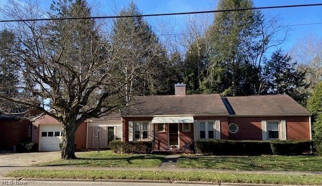 COZY & CHARMING! Here is a quality brick Ranch that has unique character with a nice floor plan. The spacious, inviting living room is nearly the length of the house. It has a gas fireplace (infrequently used), neutral carpet, neutral walls. The plentiful windows make for a bright and cheery room. This room could easily be divided with furniture to incorporate a formal dining area in addition to the living room. Fantastic front door! The eat-in kitchen has built-in storage, ample countertop and appliances not to mention a wooded view out the back. Nice linen & closet space throughout. Beautiful woodwork. First floor bathroom has ample storage, shower and linen closet. The breezeway has been a popular spot for the owners to relax or visit with family & friends. There is a wood burner that was used quite often (status today is unknown). This is a property highlight. It attaches to the deep 1-car garage. The back patio overlooks the wooded lot behind the house. The basement has an above-g