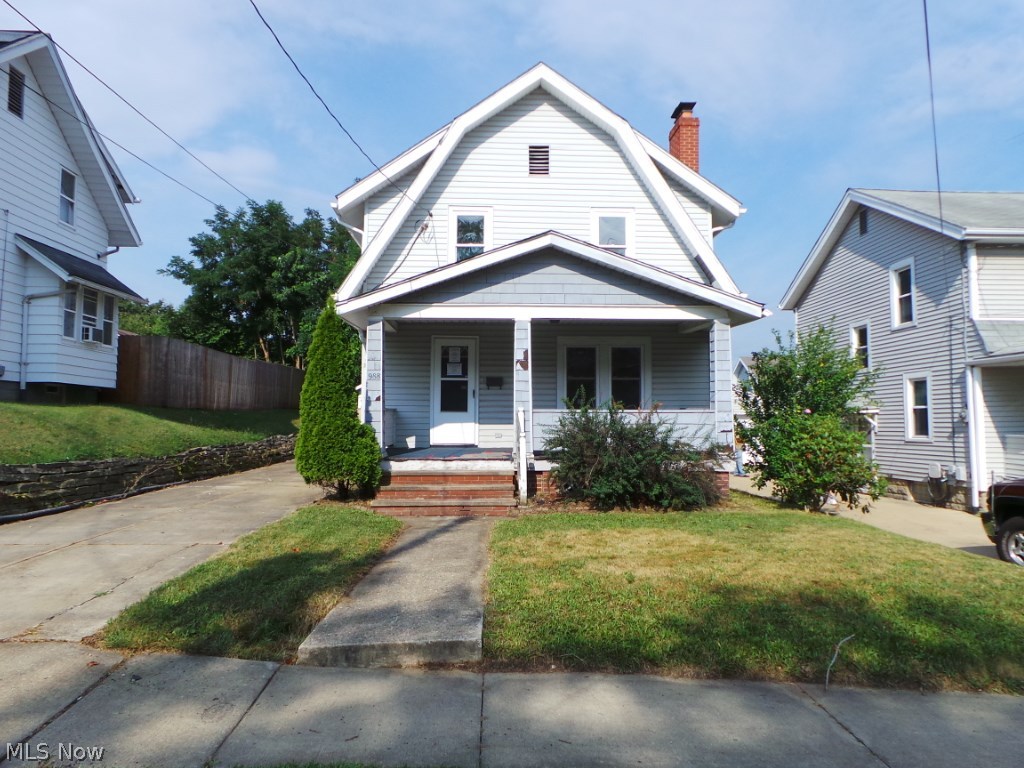 Three bedroom home with updated kitchen, large living room w/FP. Dining room. Private treed backyard. Property sold AS IS.