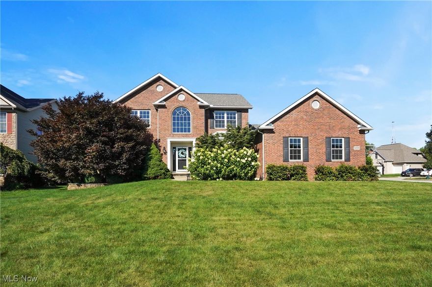 Welcome to this beautifully updated brick colonial in the desirable Bayside Lake community of Stow. This 4-bedroom, 3.5-bath home offers 3,758 sq ft of stylish, move-in-ready living space. The open-concept kitchen, eat-in area, and great room are filled with natural light. The kitchen features quartz and wood countertops, new stainless steel appliances, a farmhouse sink, and updated lighting and hardware. New wood floors run through the living room, dining room, and study, with all-new carpet throughout the rest of the home. Upstairs, you'll find a spacious primary suite with a walk-in closet and en-suite bath, plus three additional bedrooms and a full bathroom. The finished basement includes a workout area with rubber flooring and a full bath. Additional highlights include a 3-car garage, private back patio, first-floor laundry, and a new roof (2021). Conveniently located near shopping, dining, and major highways, this home offers modern living in a well-established neighborhood.