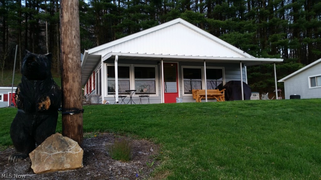 Awesome opportunity to own an Atwood Lake home with GORGEOUS LAKE WATER Views under $100k...., PRIVATE LAND almost an acre total, with boat dock (needs dock agreement for access)! GREAT ENTERTAINMENT LOCATION, Lakers Delight!!! This home has been updated throughout, if you can see it, it's been replaced or updated: washer & dryer added, all new lighting throughout, windows, paint, slate roof floor in Sunroom along with Sunroom insulation, drywall, paint, windows, laminate flooring installed in Kitchen 2012, carpet installed in Bedroom and Living Room 2012, new hot water tank 2012, complete Bathroom remodel 2012 including ceramic tile floors, ceramic tile shower, furniture style sink & cabinet; new gravel in driveway and turn around in gravel new 2014, parking beside 3 car garage (2 bays with recreation/ Bar/ Pool Table Room in 3rd bay) which is 1,200 square feet of additional indoor entertaining & parking; added parking and storage behind garage with new gravel 2014, new paint througho