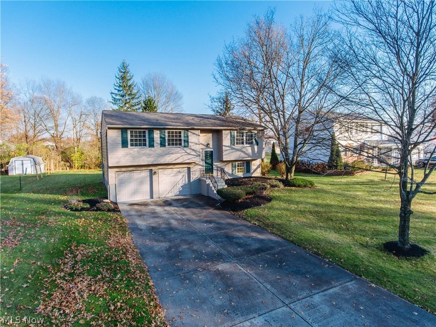 Absolutely charming 3 bed, 2 full bath bi-level home located in the desirable Mineral Ridge neighborhood. So many updates, no other house in the neighborhood compares. Updates include a brand new kitchen w/ stainless steel appliances, new cabinets, counter top, and ceramic tile flooring. Property has newer carpet, all new lighting throughout, custom fitted blinds, and has been freshly painted. It also features a newer roof (2010), newer double hung windows (2012), newer siding (2014), H2O Heater (2016), and brand new garage doors (2017). Upstairs bath has a granite counter top and self flush toilet. First floor bath includes a stand up shower. Other nice features include tons of storage, beautiful rear deck 12 x 16 w/ private back yard, concrete driveway, and brand new electrical panel. Easy access to 11, 76, 80, and 680 w/ a large variety of dining and shopping options just minutes away. This is a must see. Nothing to do but move in and enjoy.