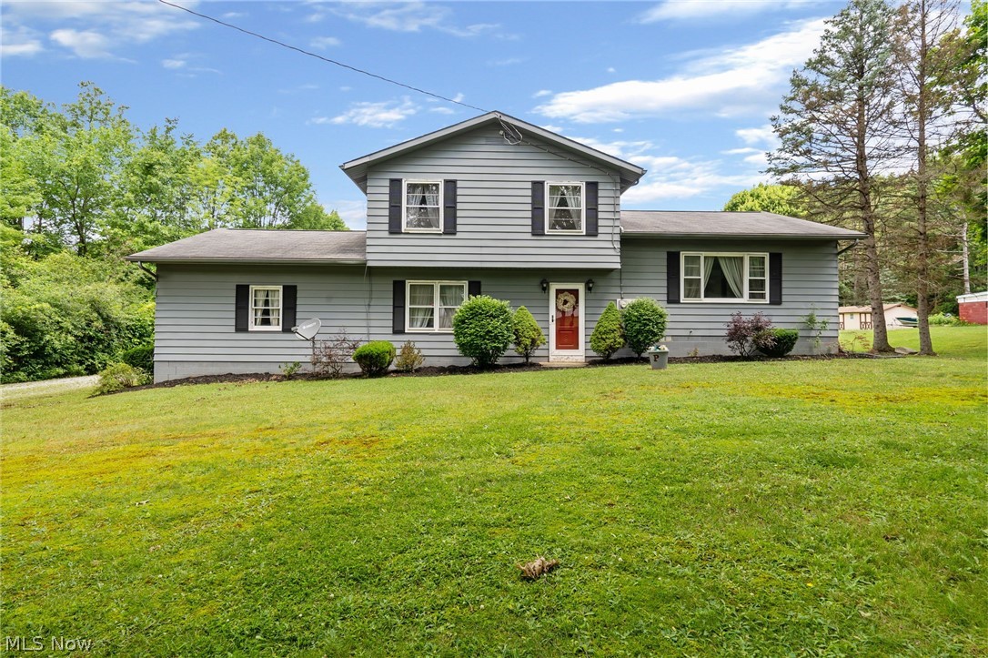 This gorgeous split level in Woodridge school district is 1764 square feet perfectly situated on 1.45 acres!! First time on the market for this gem! New carpet in the huge family room right off the attached 2 car garage. Hardwood floors through the living room and dining room. Through the kitchen follow that hallway past the recently remodeled laundry room & half bath, to complete the circle back to the family room! Upstairs you'll find 3 good-sized bedrooms, all with beautiful hardwood floors and ample closet space! Fresh, neutral paint throughout. Many updates have been made, come make the finishing touches and make this one yours :)