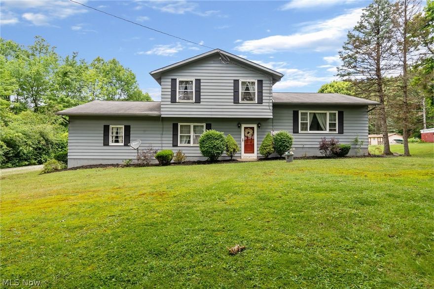 This gorgeous split level in Woodridge school district is 1764 square feet perfectly situated on 1.45 acres!! First time on the market for this gem! New carpet in the huge family room right off the attached 2 car garage. Hardwood floors through the living room and dining room. Through the kitchen follow that hallway past the recently remodeled laundry room & half bath, to complete the circle back to the family room! Upstairs you'll find 3 good-sized bedrooms, all with beautiful hardwood floors and ample closet space! Fresh, neutral paint throughout. Many updates have been made, come make the finishing touches and make this one yours :)