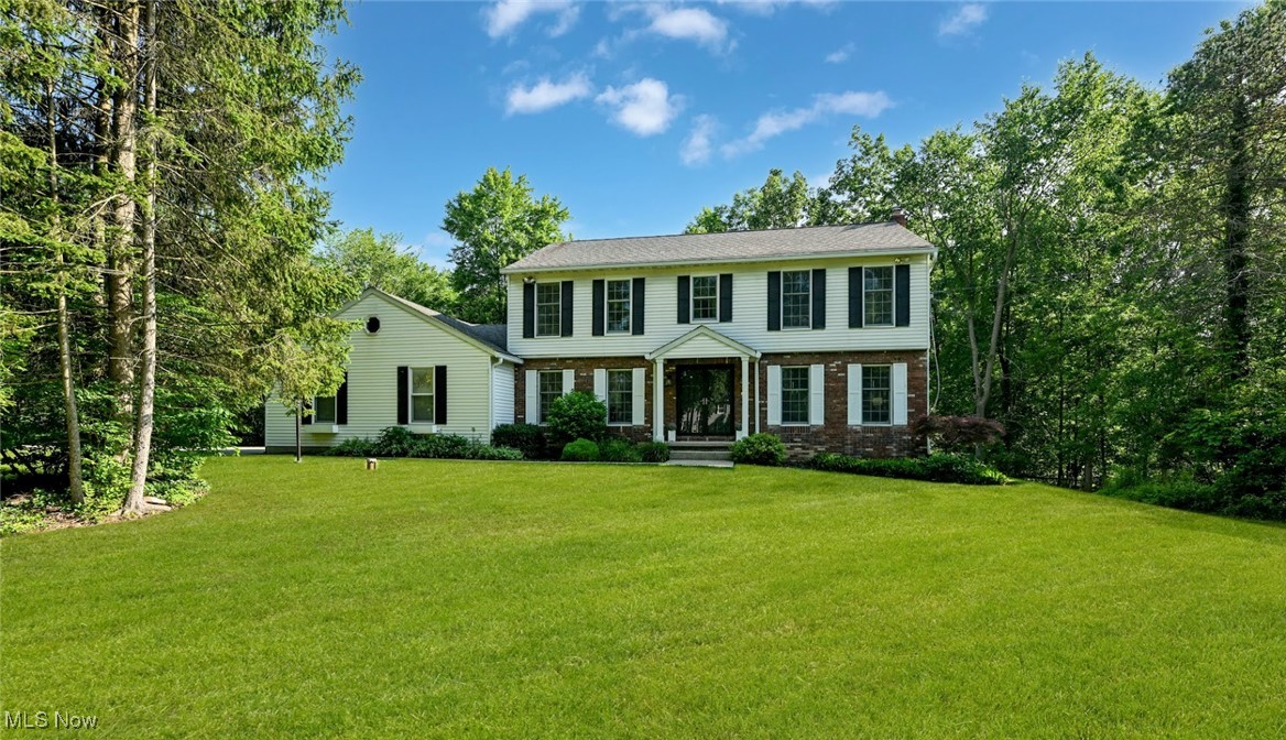 Gorgeous Colonial on a private wooded lot in Connecticut Colony!! Beautiful updates throughout! Spacious foyer entry with vintage black slate tile. The family, living, and dining rooms have solid hardwood floors. New modern floors in kitchen/ laundry room/ pantry and bath. Renovated kitchen with light cabinets and impressive Samsung oven & oversized refrigerator. Large family room w/ exposed wood beams and brick fireplace/ sliding door leads to patio. Spacious bright living room w/ newly refinished floor, dining room with chair moldings. The second level offers 4 bedrooms and 2.5 baths, including a spacious master suite w/ tile & frameless glass shower and walk-in closet. Large 2.5 car garage with newer composite door. Recently replaced double front & storm doors w/ composite front porch columns. Central HVAC was replaced/ installed new in ’17 & water heater in ‘22. Oversized driveway ground/ repaved & chimney cap rebuilt in ’22. Updated lighting in and out with all new white sockets and switches. Hudson Schools, near Montessori & Western Reserve Academy. Easy Access to 480 & 271. Hurry! Won't last!