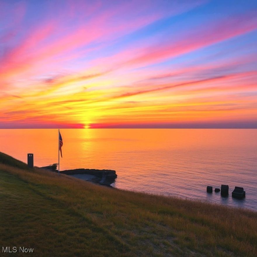High above the shores of Lake Erie this absolutely remarkable 4.5 acre Lake Erie front building lot is one of the most unique Lakefront properties you'll ever find. With a driveway from the street that leads all the way to the Lake Erie shore you can literally put out your boat or jet ski from your own property while building atop the hill as you overlook Lake Erie on the north and Village Green Golf Course to the south. Bald Eagle perches abound on the property, there is a flat, prepared homesite ready to build upon, approved location for the septic system and driveway base in place. There is no hyperbole or sales fluff in this one - it TRULY is One-of-a-Kind!