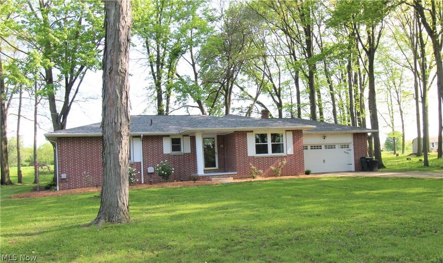 Location, Location, Location!! This 3 BR, 3BA brick ranch with 2 car garage is situated on almost a half acre wooded lot on a cul-de-sac street just outside of Orrville.  Enjoy the peacefulness of the outside sitting on the covered back patio or around the firepit.  The interior offers a remodeled kitchen with solid surface Corian counter tops, stainless appliances, and tiled back splash.  Refinished original oak flooring through-out. Remodeled bath with subway tiled shower.  Newly added full master bath featuring a barn door.  Many more updates including roof, furnace, A/C, some windows, lighting, flooring, kitchen appliances, garage door, front door, water softener, aerator for septic, full bath added in basement and much more all in 2020-2022.  Plenty of room to finish the dry basement! 
 Plenty of storage in the 14 x 10 storage building with new roof and flooring.  Don't wait too long for this one!