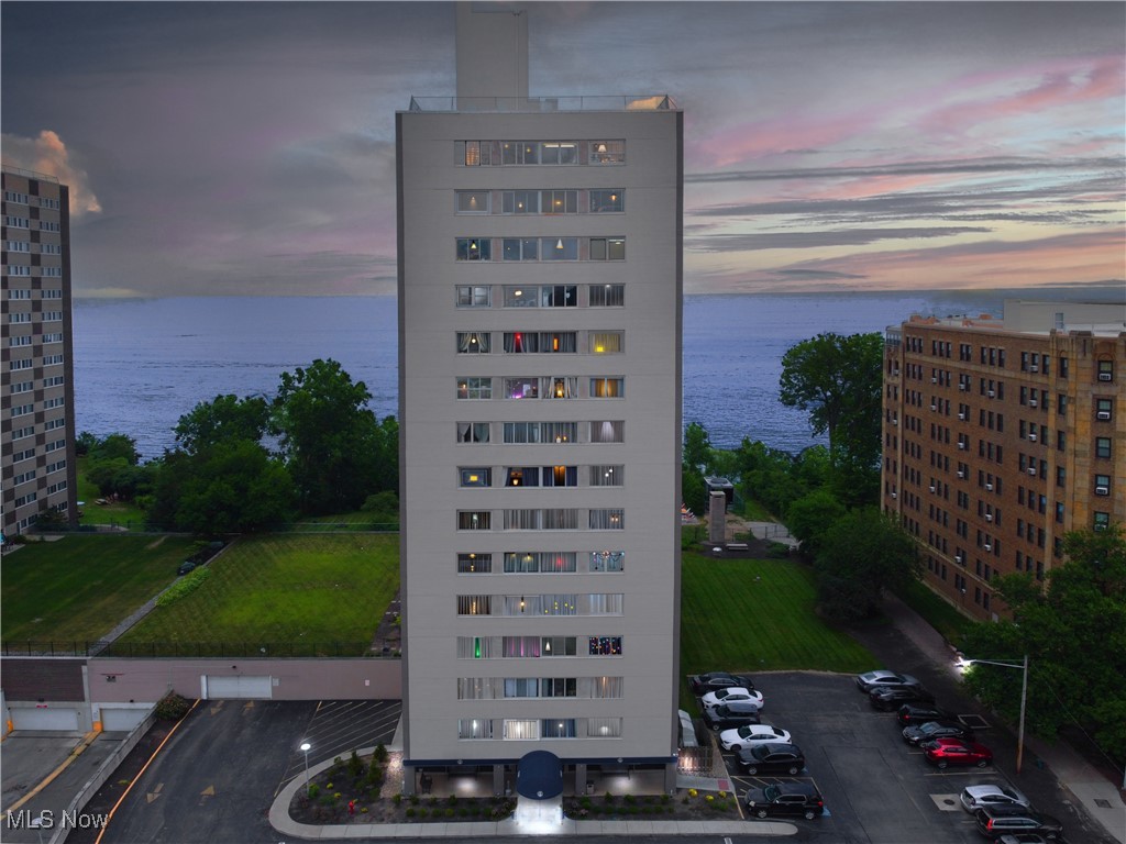 Step into this stunning, move-in-ready condominium on the ninth floor. Offering breathtaking lake views! The living room boasts new floors, fresh paint, and fresh carpeting throughout, complemented by custom window treatments. The updated kitchen features new stainless-steel appliances, including a refrigerator, stove, microwave, and dishwasher. Down the hallway you will find abundant closet space for storage, oversized closets in the bedroom and an updated bathroom with luxurious tub/shower combo. Enjoy the convenience of the elevators, trash chutes, shared laundry rooms on each floor and an optional indoor parking space (for a fee), which includes a car wash feature. The building offers a secure mail room in the lobby, rooftop access to take in panoramic views of the city skyline and Lake Erie. Check out the rooftop party room, an in-ground pool, grilling stations, picnic areas, a designated area for pets and a studio rental for $65.00/day for the residents’ guests which provide a full, at-home resort-style experience. With local amenities like restaurants, Edgewater Park Beach, downtown, the marina, Cleveland Bikeway and Gordon Square nearby, you will have everything you need within reach. The HOA fee covers all utilities except electricity. Call to schedule a visit today!