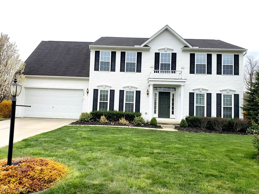 It's a WOW house!  Upgrades Everywhere! 9-foot ceilings. Tile/Wood floors. Granite countertops. Partially finished basement with a workout area. New windows throughout the house! This home has green space to the south and east.  Additional living suite built/added in 2014 great for in-laws, boomerang kids or just large families.  There is a 2nd kitchen in the living suite and a separate driveway to the additional living area.  Stamped patio and SO MUCH MORE!