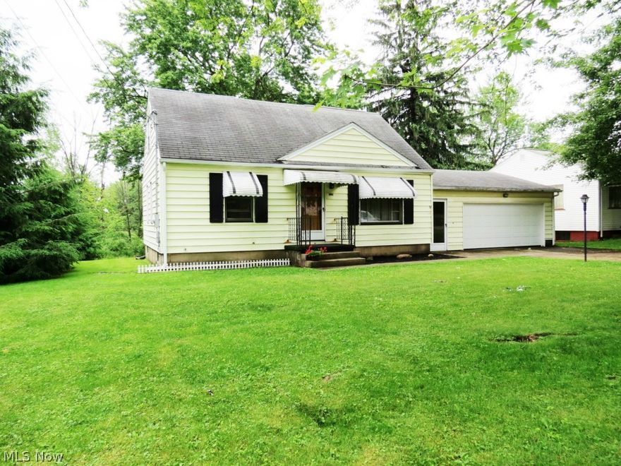 Great price on this charming, 3 Bedroom, vinyl sided, cape cod home on a nice sized lot in the Howland School District.  Large eat-in kitchen with appliances, has new carpeting, wallpaper, ceiling fan, paint (June 2015). Spacious living room, nice hardwood floors, 2 bedrooms on first floor, one on the second floor, plus an office. Updated electric, some new plumbing and fixtures, glass block windows and more. 2-Car attached garage with new garage door plus a 17x14 workshop.  This house only needs your personal touch to make it a your "home". Call today & start packing!