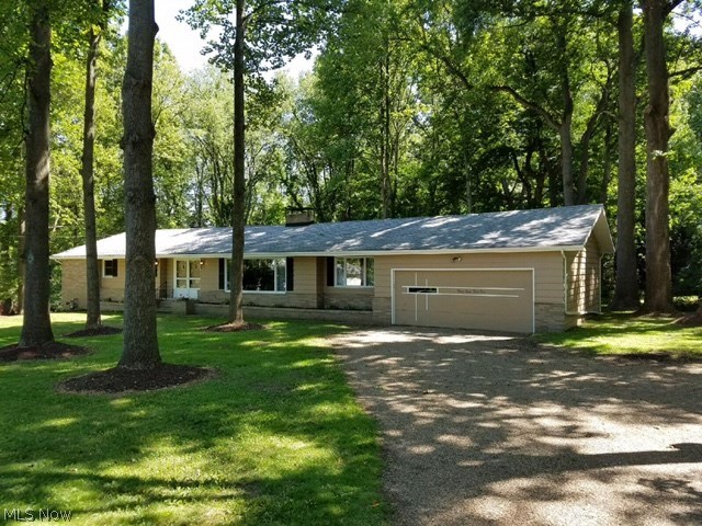 This home is a rare find. Sprawling ranch on almost an acre of gorgeous wooded property with over sized 2 car attached garage. Master bedroom has 3 closets and private full bath with walk-in shower. Every room has been updated, fresh paint and new carpet. Baths have new tile and granite counters. Living room-dining room combination with wood burning fire place is open and bright with picture window and huge foyer. Huge family room with wood burning fire place has built in book shelves and over looks the beautiful yard. Kitchen with all new stainless steel appliances and granite counters will make you want to cook. First floor laundry room or put it in the gigantic unfinished basement. bonus room in basement- work shop,play room, bedroom, also hook ups in basement for laundry if you choose. new high efficiency furnace and A/C. Ceiling fans through out , High Quality renovations. must see to believe.