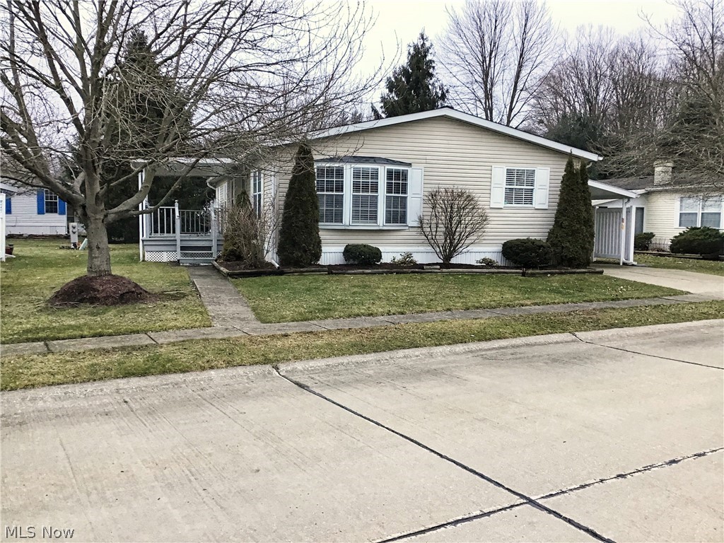 Columbia Park is Ohio's Premiere Adult (55 years and older) Land Leased Community! Amenities include; gatehouse managed entrance 24/7, on site management, walking path/dog walking path, shuffleboard, bocce ball, library, crafts and social hall! This 1992 Schult Doublewide manufactured home offers 1,456 square feet (52x28)! This home features two bedrooms, two baths, formal living room and dining room. There is a nice sized kitchen with lots of cabinet space and a skylight. Open and airy floor plan. Both bedrooms have nice walk in closets. Great size laundry area. Modern paint colors almost throughout the home. There is a great covered porch for entertaining, along with a patio partner for storage and outdoor furniture. The roof was replaced in 2019, along with the kitchen skylight. New garbage disposal. When this home was purchased in 2015, the AC unit and hot water tank were newer. Located on another very nice street in Columbia Park.