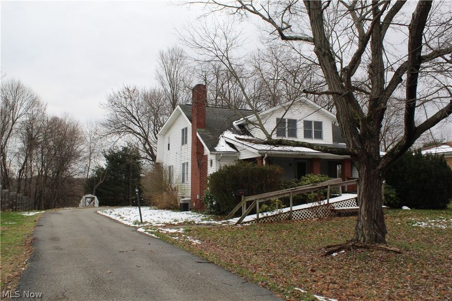 Large home with tremendous potential.  10 bedrooms and 4 full baths. This home could easily be converted in to a tri-plex with exterior entrances on main, second floor and basement.  Main floor consists of Kitchen, Dining Room, Living Room, 2 bedrooms and bath.  Second Floor has full bath and 5 bedrooms. 
Second kitchen, Living Room, 2 baths and 3 bedrooms located in the basement.  There is more area available in the basement for storage.