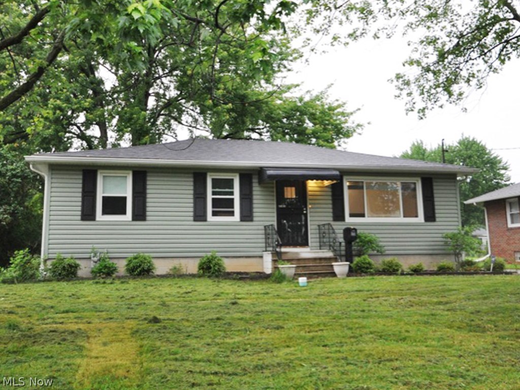 Welcome home to Lorain! This beautiful well kept, turn key ranch is ready for you to move right in! The floor plan is very spacious. It includes 3 bedrooms, living room, eat-in kitchen with newer stainless steel appliances and countertops. There is a deck built right off the kitchen! Perfect for eating outdoors. The living room, hallway and 2 out of the 3 bedrooms have beautiful hardwood flooring. The master bath on the first floor has been updated. The basement boasts 4 different rooms, to include a living room, recreation room that can be made into the PERFECT office, a larger non-finished room that would be great for a workshop, a laundry room with stacked washer and dryer, and also a full bathroom. The basement floor is made of stone...very cute! The home has a one car garage with concrete pad and awning off of the side. All appliances stay, that include, refrigerator with bottom freezer, range, microwave, dishwasher, and stackable washer and dryer. This ranch is a MUST SE