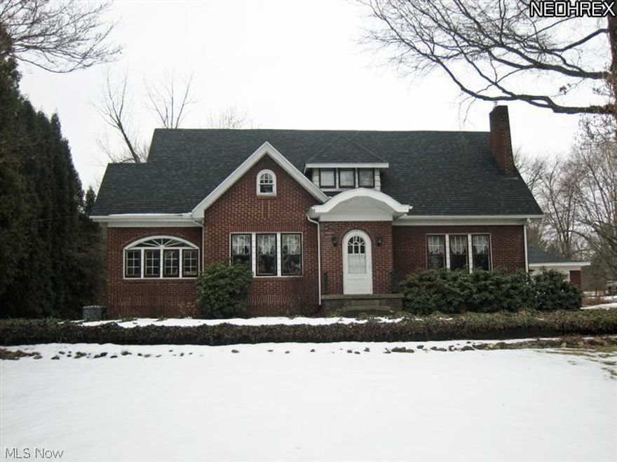 If you're tired of living in or looking at cookie cutter houses on tiny lots surrounded by neighboring houses, then you must see this home! This brick home sits on 1.5 acres with all the privacy and space you'd ever want.  This home is the best of both worlds...old world charm, yet all the updates to make it low maintenance and great functionality. Charming features include awesome hardwood floors & trim throughout, beautiful fireplace with built-in bookshelf/cabinets on both sides, a gorgeous sunroom with radius transom windows for a one of a kind look. The kitchen has been completely updated featuring a large island with bar seating on the end and an eat-in area with patio door to the large 50'x30' deck.  Home has a new hot water heater and brand new high-efficient gas furnace & A/C (Fall 2013). The large master bedroom has an attached room, perfect to be turned into a master bathroom, walk-in closet, office or nursery. Must see all the pictures! Schedule your showing today!