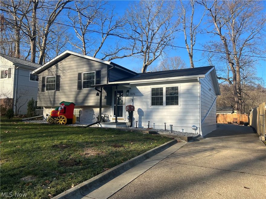 It isn't often I see a home so well cared for and as clean as a whistle.  Surrounded by the Sand Run metro park area of Merriman Valley this home sits within a hiking and biking lovers dream neighborhood. With over 1,400 sq ft of finished living space the whole home has newer carpeting or wood look laminate flooring with an open feel living room with custom built in bar.  Adjacent is the spacious eat in kitchen with new in 2021 patio slider to the rear yard. The kitchen has newer appliances in 2019. The stylish master bedroom has an updated en suite half bath and shares the updated full bath with two additional bedrooms.   The lower-level is beautifully finished into an amazing space with a large family room and combo mud room/ home office/ laundry area that walks out to a covered breezeway with covered patio and to garage.  This level also offers a half bath. The backyard is fully enclosed with a wooden privacy fence and includes a beautiful stone patio with pergola and fire pit area.