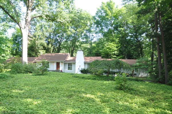 Sprawling ranch tucked into lush natural landscape, perched above a beautiful ravine & flowing creek. This gem features a new contemporary kitchen, hardwood floors, fireplace & den offering built-ins & expansive views. Two spacious bedrooms and remodeled bath. True park setting at your back door!