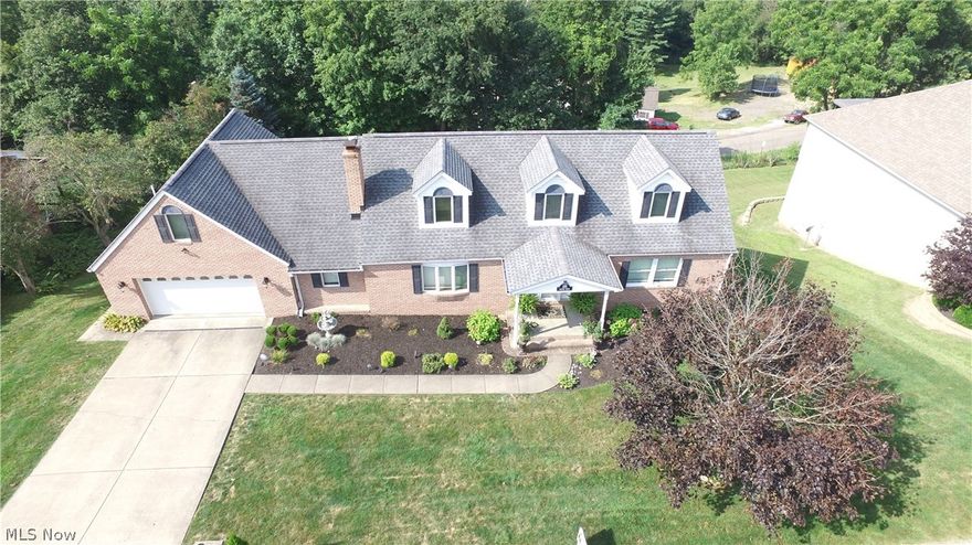 Outstanding inside and out this 1.5 story family home with 4 bedrooms and 4 baths is located in a great neighborhood. Newly painted interior and loads of updates including open floor plan for your livingroom with gas fireplace, dining room that walks out to a Trex deck for grilling and lounging, and a large eat in kitchen. Beautiful granite counters, stainless steel and large butcher block island for storage and meal prep. Sit at the granite topped side counter or in the bright bayed window breakfast area that has pantry cupboards floor to ceiling. Large first floor laundry. The Master Suite has dormers and sky light and its own fireplace. Master bath is updated with corian and above counter double bowl glass sinks. Large walk in tiled shower with frameless glass door and a corner jet tub. Office has hardwood and its own private deck. Large finished recreation room, lots of storage area. Beautiful private double Trex deck gives loads of additional outdoor living space for family and fr