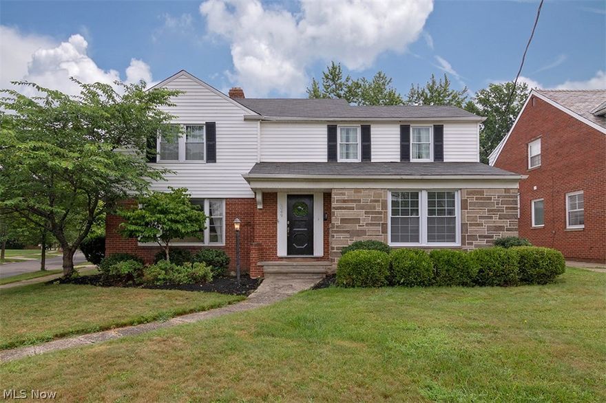 Fall in love with this beautifully updated colonial in University Heights! Illuminated by a picture window, the living room is open and inviting with a stone fireplace, beautiful hardwood floors, and coved ceilings that continue in the dining room. Off of the dining room, there is a lovely screened-in sun porch, so you can easily enjoy meals in the summer breeze. The kitchen is tastefully updated with stainless steel appliances, white cabinetry, subway tile backsplash, and a sunny eat-in area with a bench. A half bath and a home office complete the first floor. Upstairs, you will find three spacious bedrooms, a beautifully updated full bathroom with two sinks, and a balcony. The lower level is partially finished with a spacious family room, plus a laundry area with newer nature stone flooring and a newer furnace and water heater.  This charming home is tucked on a corner lot in University Heights with a two-car garage and a fully fenced-in backyard, great for children or pets! It is on
