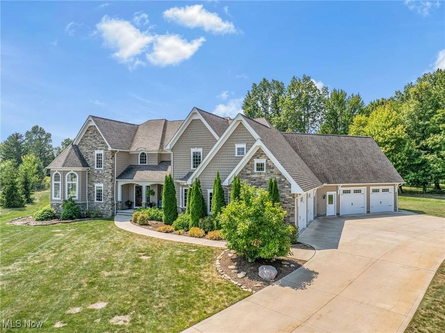 This stunning 6,068 square foot home, freshly painted throughout, sits on a sprawling 1.18-acre lot, offering an exquisite blend of elegance and comfort. Upon entering, you are greeted by a grand two-story foyer featuring an elegant wrought iron staircase that sets the tone for the entire home. The expansive interior is adorned with hardwood, tile, and carpet flooring, and includes a cozy fireplace for those cool evenings. The heart of the home is the chef's dream kitchen, equipped with high-end appliances including a dishwasher, garbage disposal, microwave, range/oven, and refrigerator, perfect for both everyday living and entertaining.

The opulent owner’s suite is a private retreat, boasting a turret sitting room, a spa-like walk-in shower, and vaulted ceilings that add a touch of grandeur. Secondary bedrooms #2 and #3, along with #4 and #5, are equally impressive, each pair connected by Jack and Jill bathrooms and featuring soaring vaulted ceilings. Bedroom #5 offers access to expansive walk-in storage above the garage, with the potential for future finished square footage. The lower level is an entertainer's paradise, complete with daylight windows, a wet bar, and a full entertainment center, making it an ideal space for gatherings.

Outside, the home’s stone and vinyl exterior, coupled with park views, provides a serene escape from the hustle and bustle of daily life. With an attached garage accommodating four vehicles, parking is never a concern. Located in a tranquil neighborhood with a low HOA fee of just $20 per month, this home offers the perfect combination of luxury, space, and location. Central air conditioning and forced air heating ensure year-round comfort. This property is more than just a house—it’s a lifestyle. Don’t miss the opportunity to own this breathtaking home where memories are waiting to be made!