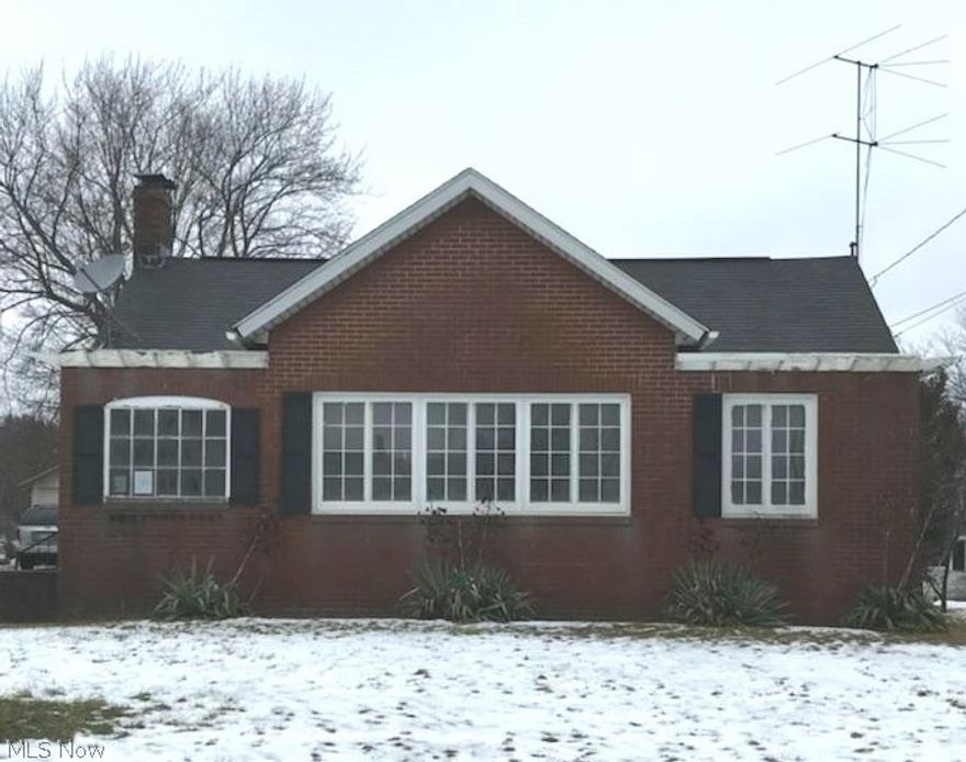 Opportunity knocks! Investor liquidating! Add your touches and make this home or make this the best investment you have ever made. This home features a oversized living room and dining room . Dining room features a fireplace and amazing hardwood floors. With an acre of land the possibilities are endless for this home. Septic will need replaced at buyers cost. Call today. Don't wait. MOTIVATED SELLER!! MAKE AN OFFER!