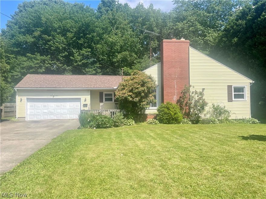 ALERT! Hard to find 3-bedroom ranch in Kent! This ranch is nestled in a tree-lined neighborhood in the city of Kent. With a large yard that is surrounded by trees and privacy, you will love the peace and tranquility that this home can give you. All entry into the home is made completely accessible with a ramp in the front and a ramp to the back deck. Once in the home, you are greeted by a large living room space, that is centered by a stone fireplace and an abundance of natural light through the large windows. The eat-in kitchen has plenty of cabinet and counter space and leads directly to the backyard and the oversized 2-car garage. All three bedrooms are on the main level, including the oversized primary bedroom that has 2 closets- one of which is walk-in cedar-lined closet. The full bathroom is large and bright, with an updated vanity and flooring. The full basement is ready for you to finish and has loads of space for storage or additional living space. Roosevelt Street is located near Longcoy Elementary, the hike and bike path, public parks, the Cuyahoga River and all that downtown Kent has to offer! Do not miss this opportunity to own this slice of easy living.