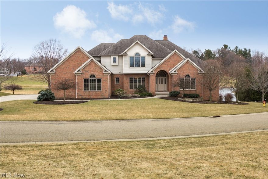 Premium property inside the gated community of Glenmoor Estates. Home is situated on a cul de sac with a sweeping panoramic view of the golf course hole number 9, the club house and a pond. Gourmet kitchen with granite counters, nice island , double ovens, prep sink, two dishwashers and a new stainless steel refrigerator. Back staircase off kitchen. First floor master suite with large closet and a spacious bathroom. Glamorous staircase in the foyer that takes you to the second floor where you have three bedrooms one jack n' jill bathroom and one en suite. Let's not forget the finished walk out lower level that includes two bedrooms, one full bath and plenty of space for entertainment. Low maintenance brick home with Trex deck. This is a unique property that combines golf and water view. House had many updates including new light fixtures, New hickory wood floor throughout the first floor , new carpet, new Jen air cook top and many more....