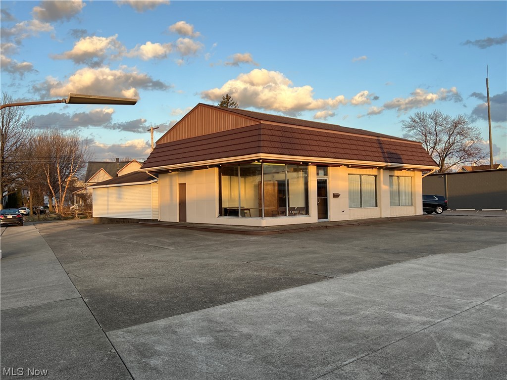 2,073 square foot commercial/retail location. Tenant to pay all utilities. Gas heating with central air and 200 amp electric. 10' overhead double door. Vinyl sided 2 car garage with double overhead door. Great potential for your business. Excellent high traffic location on the corner of South Wooster Avenue & East Broadway. Triple net lease. Available for lease or for sale at $275,000. See mls#4440863. Surrounding business include Pizza Hut & Williams Furniture. Main thoroughfare connecting Dover to New Philadelphia. Square footage reflects both buildings.
