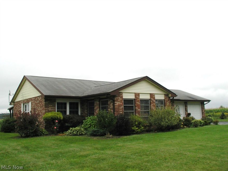 NEW PRICE! Cozy brick ranch on 1+ acre within the Village of Carrollton. 2 bedroom and spacious living room leads out to front and back 12x16 Florida rooms. Attached 2 car garage and beautiful landscaping leads to a peaceful setting at the end of the street. There is plenty of room for your supplies in the outside storage shed. Come and enjoy. immediate possession!