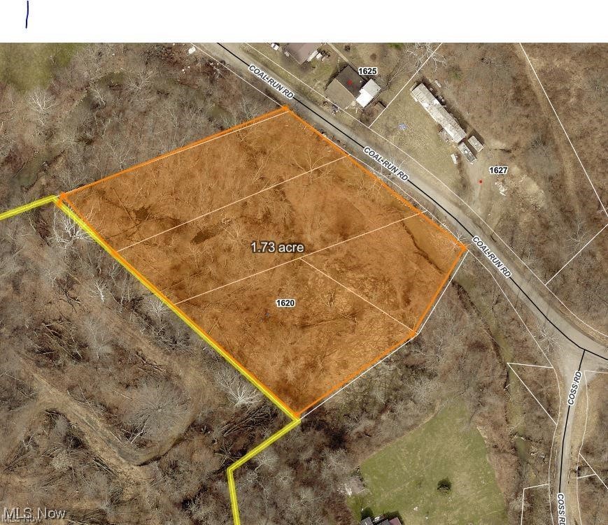 Close to the city, wooded lot. Public utilities available but will be the cost of the buyer. No driveway to access the property across the creek.