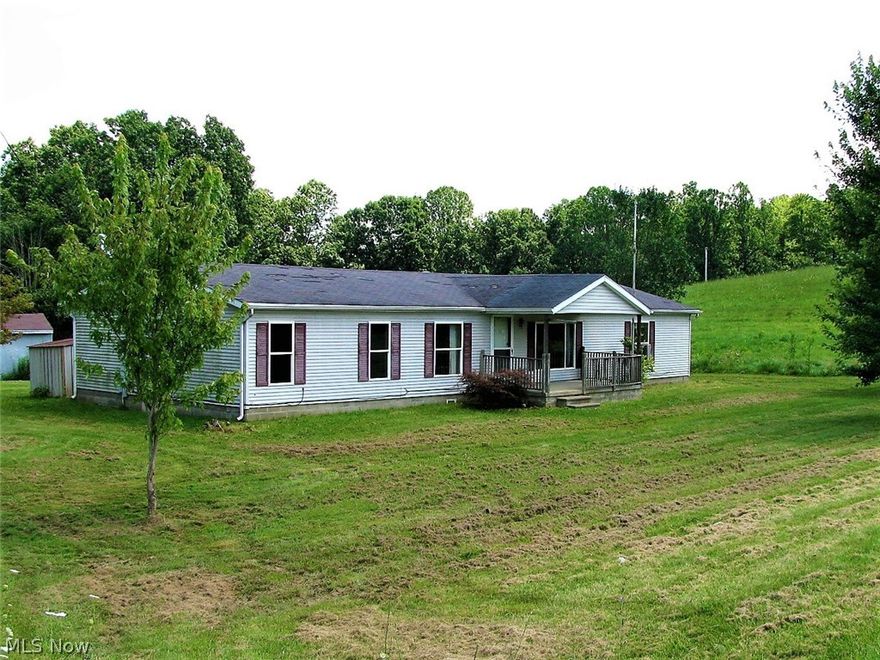 This home offers great space for a great price! The one story home boast 1848sq feet of living space, large open rooms, 3 bedrooms, 2 full baths, family room, living room, and dining room.    Outdoors you will find a oversized back deck that is perfect for lounging, shed, and barn/workshop.  The home and buildings are all situated on a little over 1 acre of flat land.  Whether you are looking for a seasonal or year round home do not miss this one!