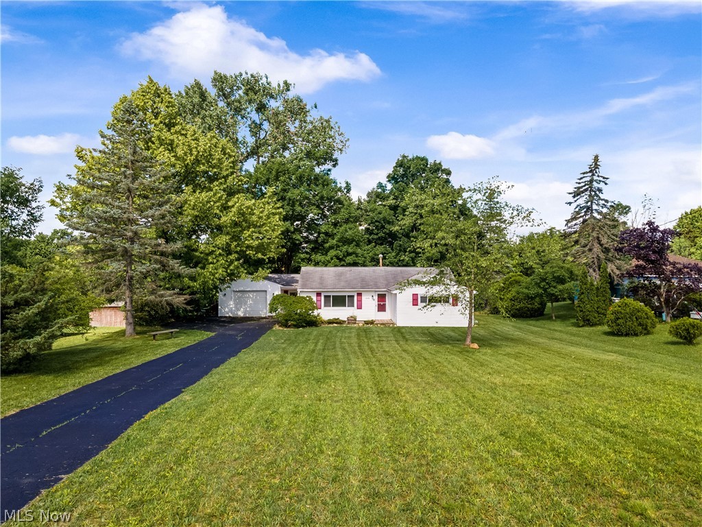 Don't miss out on this ranch that's located on almost half an acre just minutes from downtown Streetsboro! Offering 3 bedrooms and 1 bath, with over 1260 square feet. New flooring, carpet, updated kitchen, and A/C have been added. The backyard is private and offers a large deck! The driveway has also been freshly sealed with blacktop. Quick occupancy available, just move in and enjoy!