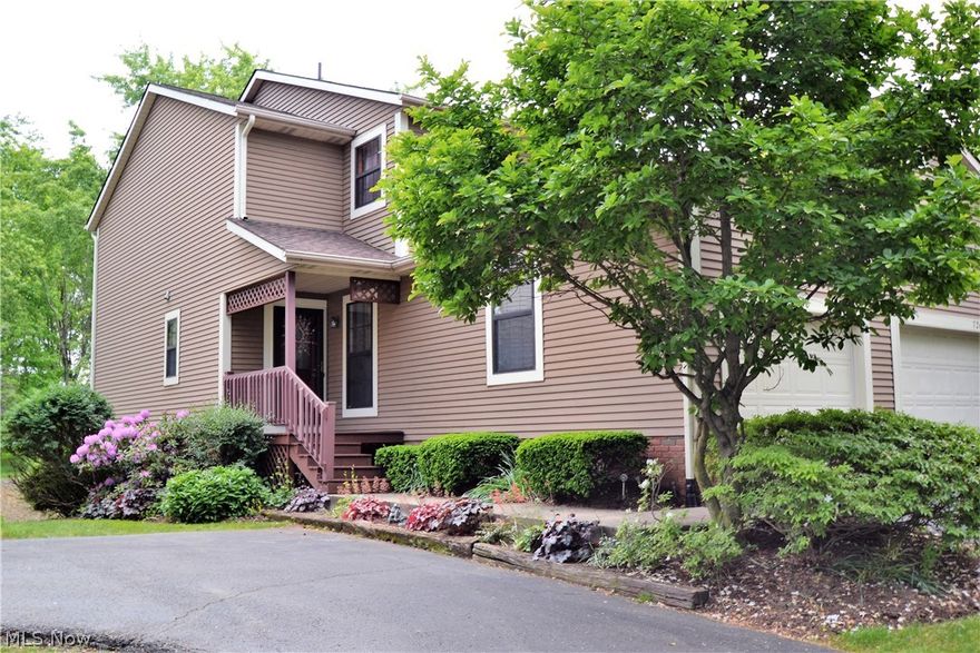 Enjoy the beautiful lake view from the upper deck or lower level patio of this nice condo in Jackson Township's Wood Lake.  Neighborhood features a common 1/4 mile walking trail around the lake with fountains, gazebo, and community paddle boats.  Kitchen with hardwood floor, tile backsplash, and stainless steal double oven has a pass through to dining/great room with gas fireplace and a walk-out to a Trex deck.  First floor also has a 1/2 bath with Corian sink and hardwood floor. Two second level bedrooms and a full bath with tile floor, garden tub and skylight that opens.  The large finished lower level recreation room has a walk-out to back patio, 1/2 bath and laundry room.  Carpets have been professionally cleaned and condo freshly painted in a neutral color.  Updates new garbage disposal and hot water tank, a/c approx. 7 yrs, roof approx. 3 yrs., furnace approx. 15 yrs.