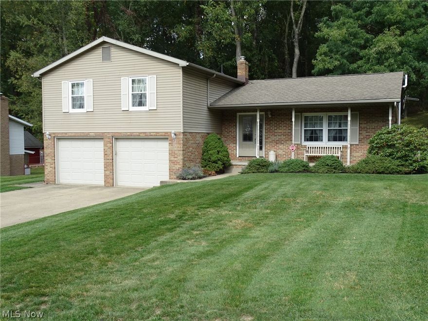 Perry Twp, Perry Schools. Lovely 4-bedroom, 4-level brick & vinyl split. 2-1/2 Baths. Lg. master bedroom w/adjoining master bath. Oak & marble gas fireplace in roomy family room. Formal dining room plus lg. eat-in oak kitchen. Inviting foyer entrance has a leaded glass door flanked by a matching sidelight. Oversized 2-car garage includes storage alcove. Half acre treed lot w/56x43 fenced area. 12x8 storage barn. Family room has sliding glass door to a patio. Ceramic tile entry way from garage. Lots of closets. 97.5% efficient Carrier furnace & Carrier central air. Newer insulated windows. Roof, vinyl siding & spouting 2008. Stainless steel appliance in kitchen (refrigerator is almost new). All 3 bathrooms renovated. Washer, dryer & chest freezer remain. All carpet recently replaced. Kinetico water softener, reverse osmosis system & security system.  Custom built one owner home .