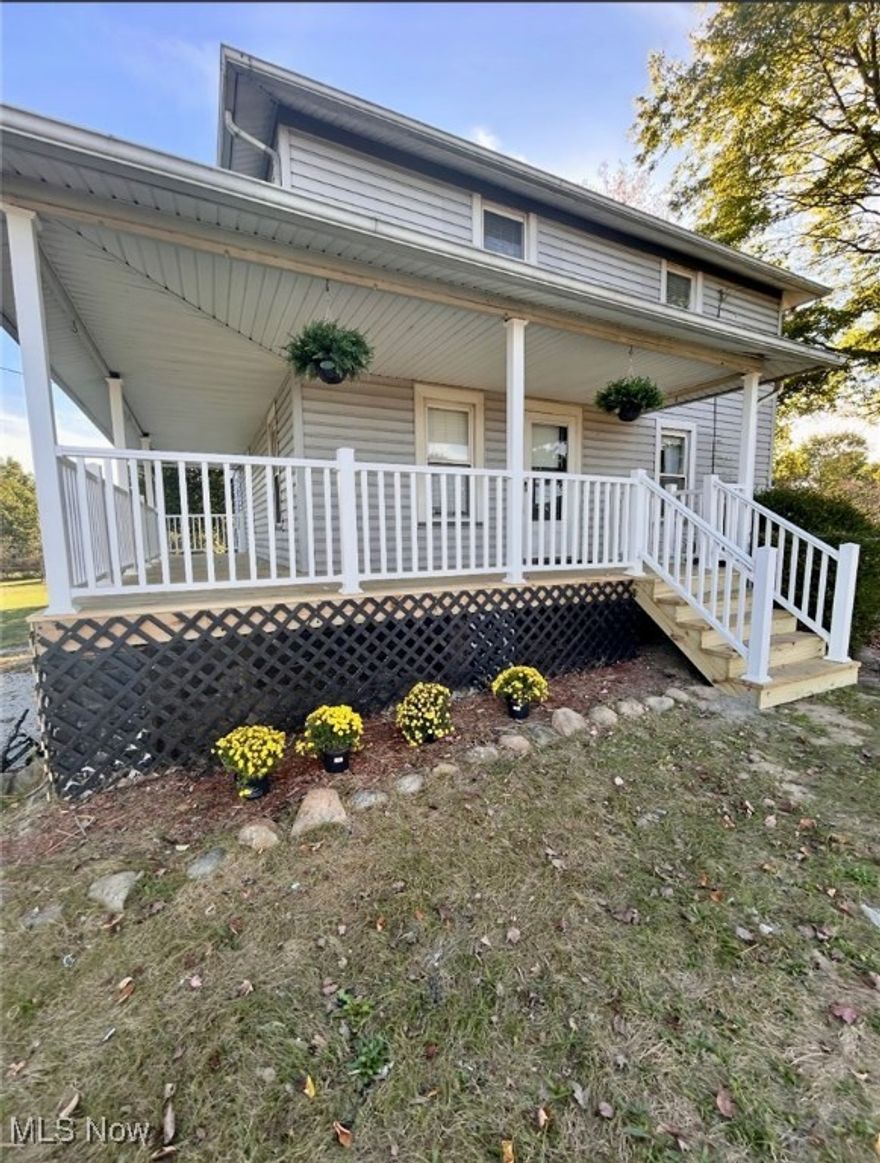Welcome to this gorgeous home with breath taking views of sloping farmland with a brand new wrap around front porch! Just minutes away from the local winery's, golf courses, and plenty of shopping its sure to make a statement. This one boosts 4 bedrooms and 2 bathrooms with open concept living sitting on over 1 acre! The first floor is complete with a formal living room and an electric fireplace right off of the kitchen/ dining space. The perfect nook for a home office leads you to a full bathroom and large vaulted ceiling family room. One main floor bedroom finishes off the first floor, with the three other large bedrooms upstairs along with a bathroom. A nice walkout basement with ample storage and one car attached garage.  Call your agent to come check this one out today!
