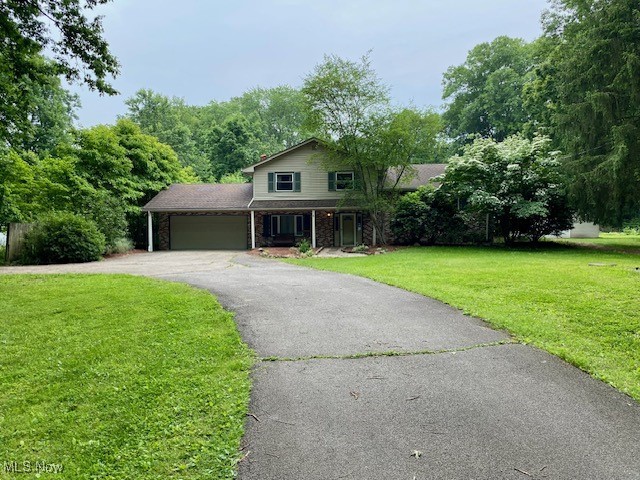 Discover comfort and charm in this beautiful split-level home nestled on a serene 1.3-acre lot. From the inviting front walkway to the peaceful backyard, every detail of this property feels like home. Located at 3301 Hewitt Gifford Road in Newton Falls, this three-bedroom, two-bath home offers a warm and welcoming layout with thoughtful updates throughout. Gleaming hardwood floors flow through the living and dining areas, where a gas fireplace adds cozy ambiance. The kitchen has been freshly painted and includes all appliances, while the dining area leads to an enclosed sunroom—perfect for enjoying your morning coffee or hosting guests. Upstairs, you’ll find three bedrooms and a full bath, all with beautiful hardwood flooring. The main level also features an updated family room with a wood-burning stove, sliding doors to a patio, and a brand-new full bathroom with a modern vanity, stand-up shower, new toilet, and fresh fixtures. Additional highlights include a two-car attached garage and a large detached outbuilding with electric-ideal for a workshop or additional storage-and spacious enough to accommodate 2-3 vehicles. This move-in ready home combines privacy, space, and comfort—all within reach of local amenities. This home is heated with fuel oil, and a gas line has been run to the home to supply the fireplace.