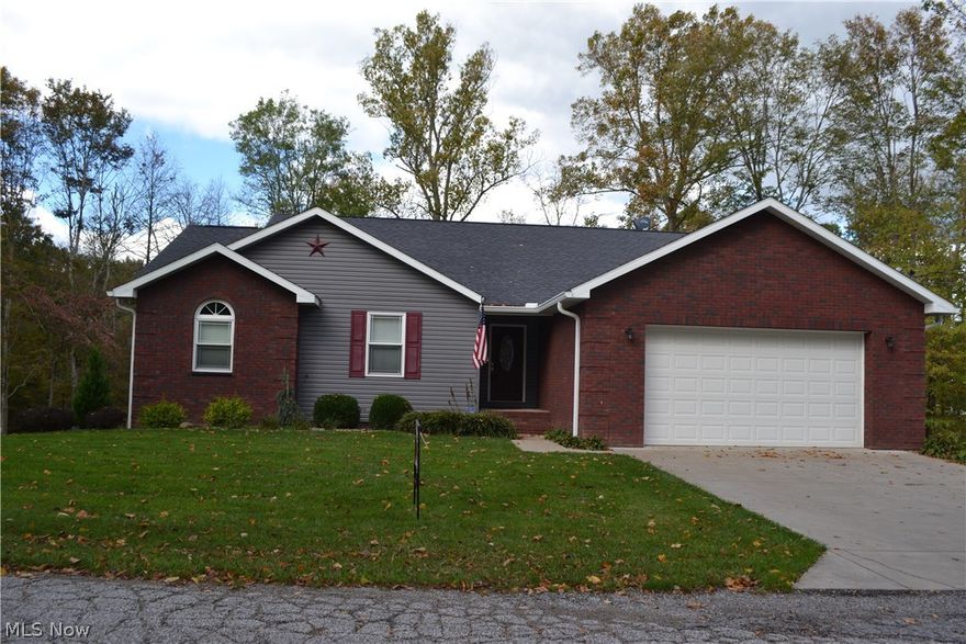 Hurry and you can spend the holidays in this nearly new home! Built in 2009, this house offers a custom kitchen with appliances, great room with fireplace, master suite with double closets, 2 additional bedrooms and full bath on the first floor. The walkout basement features a wonderful family room and recreation area. Enjoy a theater space, bar area, 4th bedroom and full bath. The back porches overlook a wooded area. The home has a wonderful built-in gun safe. Storage is plentiful with a convenient walk up attic. This is not a drive by property, this is a MUST SEE!!