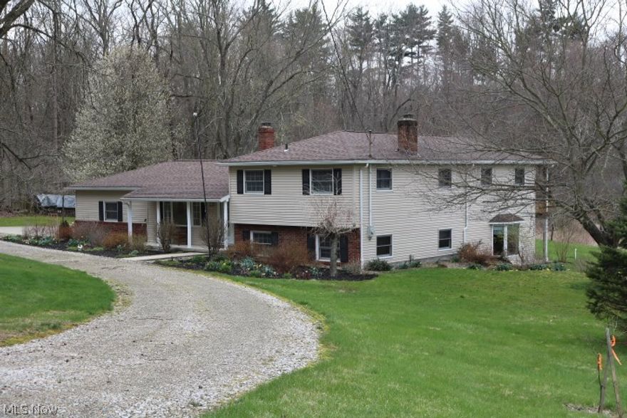 > Refreshing split level nestled in a small valley with the beauty of nature all around. Warm kitchen complete with exposed beams, pull out cabinets. Formal dining room perfect for friends and family to come together. Master bedroom with cathedral ceilings, master bath, and spacious walk-in closet, doors to second floor deck over looking lush nature. Family room with wood burning stove as well as an over-sized recreation room, playroom/office finish off the lower level. Spare rooms all have ample storage space in the closets. 
> This one won't last long! Includes a 1 year America's Preferred Home Warranty.