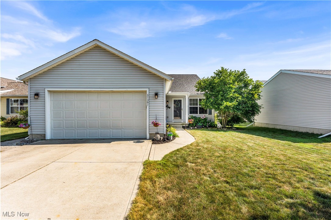 Gorgeous 4-bedroom, 2.5-bathroom split-level home in the highly sought after Meadow Lakes Subdivision in North Ridgeville. Enter into the open concept first level featuring vaulted ceilings, stylish light fixtures, formal living/dining room, and spacious kitchen with eat-in area. Eat-in kitchen leads to access to a peaceful stamped concrete patio and fully fenced yard- ready for all your outdoor entertaining needs and gardening hobbies! Kitchen features new stainless-steel appliances and new sink with reverse osmosis system. Head upstairs to three sizeable bedrooms and 1.5 bathrooms. Upstairs bathrooms offer new flooring and new vanity in ½ bathroom. Downstairs you will find a large living room perfect for all your gatherings in addition to another full bath and bedroom. There's even more- continue downstairs to a finished basement space providing ample storage and options for a wonderful recreation/entertaining space! This well-maintained home provides so many possibilities and much space. Additionally features a NEW ROOF (2024) and all screens replaced with PetSafe screens. New owners will enjoy the beautiful green space, walking paths leading to The Sandy Ridge Reservation, convenient freeway access, and stocked ponds unique to this well-planned community. It’s all right here! Schedule your showing TODAY!