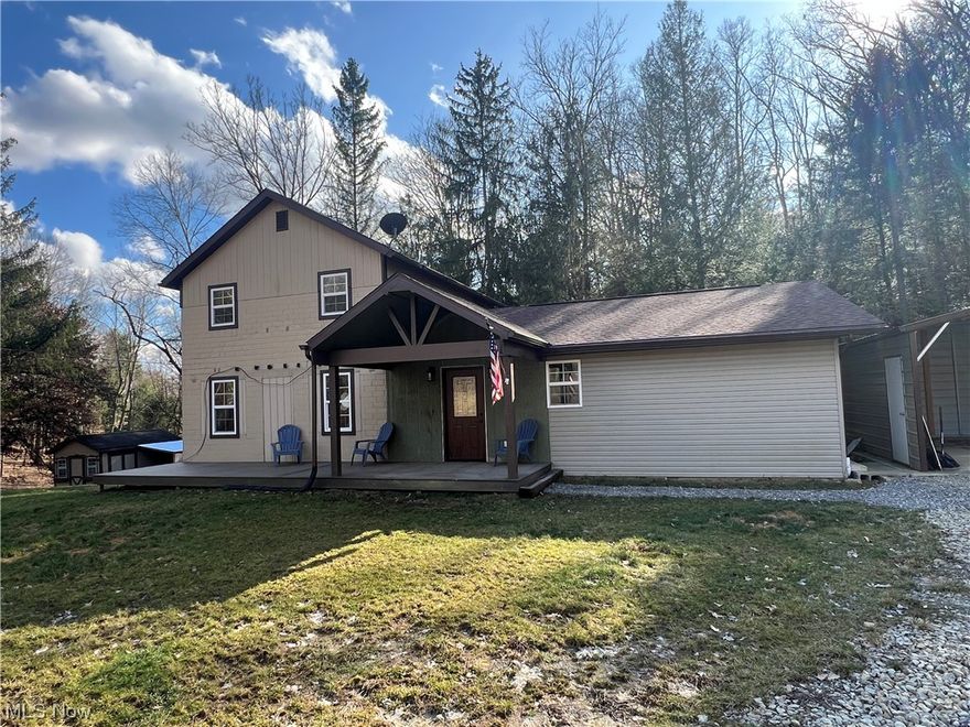 Looking for a private country setting, close to town?  Look no further!  This 2 bedroom, 1.5 bath home sits on a 1.6+/- acre wooded oasis and is located just minutes from town.  Beautiful tongue and groove 16' ceilings in the living room with open stairway to the second floor.  Updated hickory kitchen with tongue and groove beamed ceilings and island includes the stainless steel appliances.  Main floor master bedroom features a barn door to the walk in closet, electric fireplace and private access to the full bath.  Spacious main floor bath boasts a walk in shower and soaking tub. Main floor laundry room with washer and dryer.  Full, walk out basement features a Pellet wood burner.   2 car carport and 8 X 12 storage shed.  Updates include pex plumbing with manifold system, new septic in 2018, new asphalt roof in 2017 & 2019, new front door in 2024, new carpet in the living room and loft in 2024.